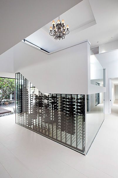 The entertainer – exposes their wine collection openly as central focal point within their home.